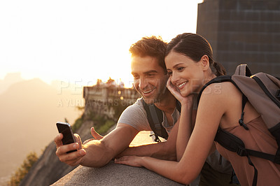 Buy stock photo Cropped shot of a young couple touring a foreign city