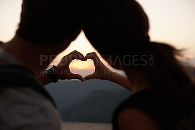 Buy stock photo Travel, heart hands and couple in mountains with view of sky together on holiday or vacation abroad. Love, hiking or backpacking with emoji of man and woman outdoor for tourism overseas from back