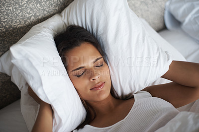 Buy stock photo Woman, pillow and frown for noise, stress or tired for insomnia or nightmare in bedroom in Las Vegas. Mental health, female person and angry for sleepless, fatigue and loud sound in hotel room