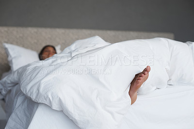 Buy stock photo Lazy, feet and woman in bedroom sleeping, house and white duvet for bedding, nap and exhausted. Morning, dream and female person on day off to relax in apartment, rest and cosy with blanket on bed