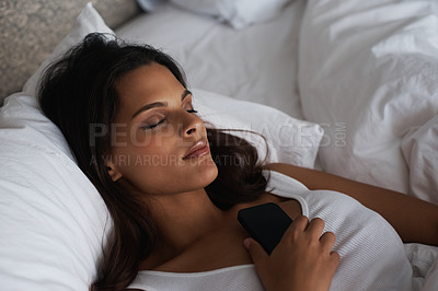 Buy stock photo Night, sleep and woman on bed with phone waiting for call, tired and fatigue for girl in home. Female person, peace and relax in bedroom with mobile for communication, contact and app to connect