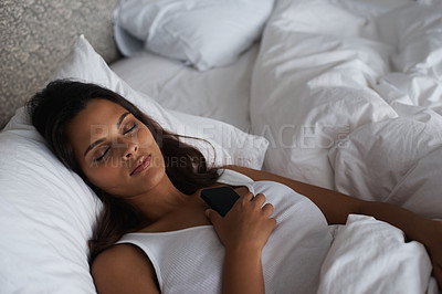 Buy stock photo Bedroom, night and woman with phone, sleeping and social media and connection to internet for app. Bed, tired and communication with mobile, digital and female person on dating site with technology