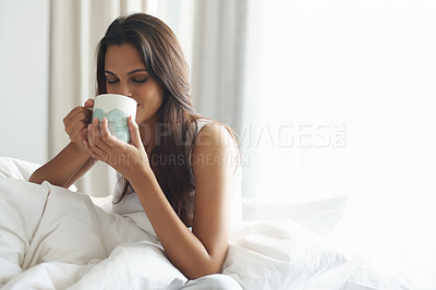 Buy stock photo Smile, calm and woman with coffee in bedroom with caffeine to wake up in morning at home. Happy, relax and comfy young female person drinking mug of cappuccino, espresso or latte in apartment.