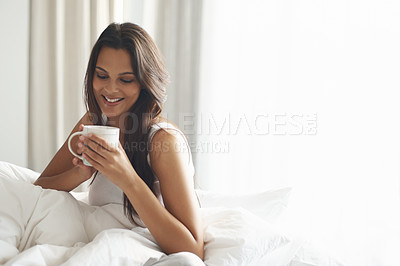 Buy stock photo Happy, calm and woman with coffee in bedroom with caffeine to wake up in morning at home. Smile, relax and comfy young female person drinking mug of cappuccino, espresso or latte in apartment.