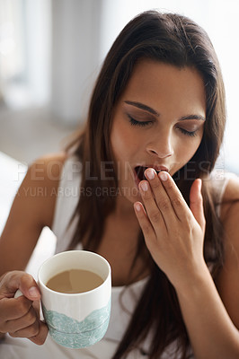 Buy stock photo Yawn, tired and woman with coffee in bedroom with caffeine to wake up in morning at home. Exhausted, burn out and sleepy young female person drinking cappuccino or latte for fatigue in apartment.