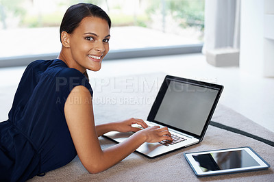 Buy stock photo Laptop, smile and portrait of woman relaxing on carpet working on freelance project at home. Happy, technology and female person with computer for creative research laying on floor mat in living room