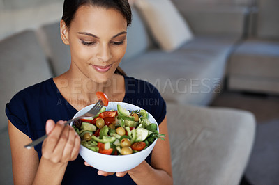 Buy stock photo Black woman, smile and salad for eating, food and health on sofa, couch and lounge at home, house or living room. Female person, vegan lady or vegetables for diet, wellbeing or nutrition for vitality