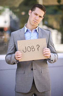 Buy stock photo Poster, jobless and stress for man with suit, outdoor and adult with unemployment with poverty. Male person, search and hunting for work with cardboard sign on street in city of Cape Town for career