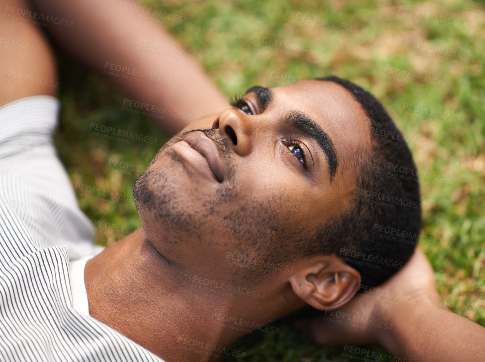 Buy stock photo African man, thinking and relax on grass in nature, idea and vision on summer holiday plan. Thoughtful, enjoying fresh air or reflection, sunshine and peace for freedom after work week on vacation