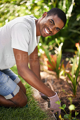 Buy stock photo Portrait of a handsome young black man gardening