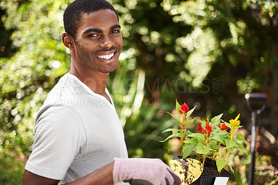 Buy stock photo Portrait of a handsome young man gardening