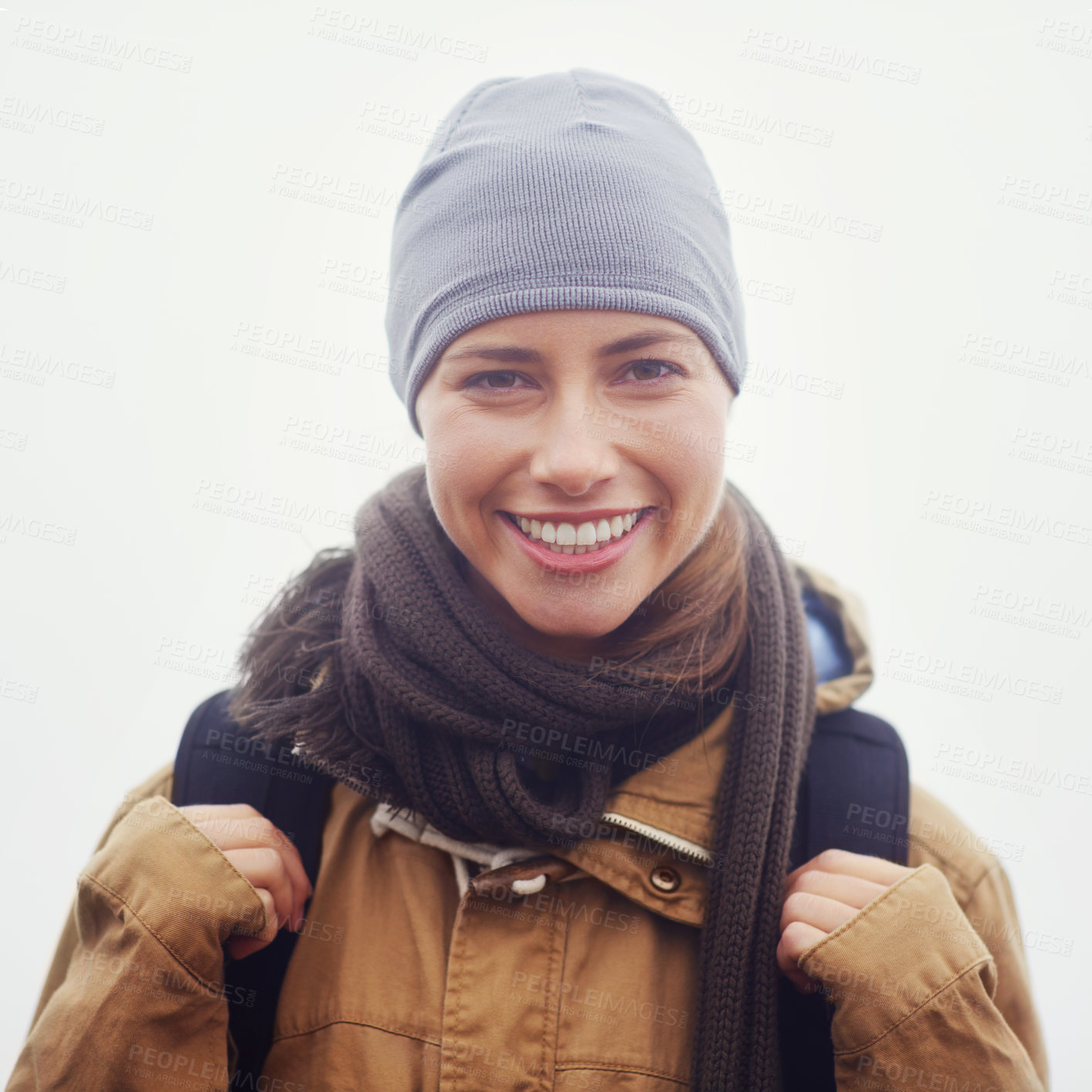 Buy stock photo Closeup portrait of an attractive young woman out hiking on an overcast day