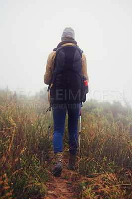 Buy stock photo Person, hiking and back in countryside for trekking, sticks  and support for fog trail in mountain. Athlete, backpack and sport gear for safety in cold environment, slippery and walking for fitness