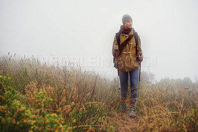 Buy stock photo Woman, hiking and thinking in countryside for trekking, sticks  and planning by fog trail in mountain. Athlete, backpack and sport gear for safety in cold environment, idea and walking for fitness