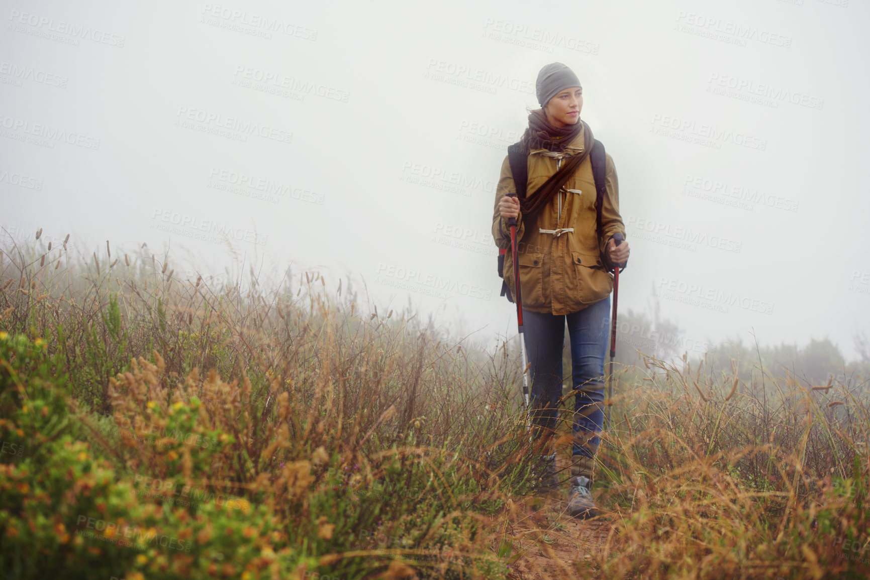 Buy stock photo Woman, hiking and thinking in countryside for trekking, sticks  and planning by fog trail in mountain. Athlete, backpack and sport gear for safety in cold environment, idea and walking for fitness