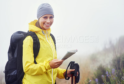 Buy stock photo Portrait of an attractive young woman standing in her hiking gear and holding a map