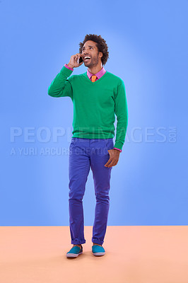 Buy stock photo Fashion, black man and phone call in studio for color block  in trendy clothes, style and outfit. Male person, stylist and fashionable for season trends with funky, edgy and formal wear in happiness