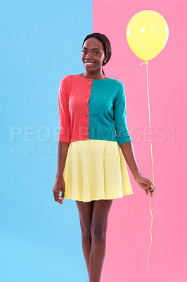 Buy stock photo Black woman, fashion and portrait, balloon and smile or happiness with color block background. Stylish, trendy and vibrant for female model person, fun and unique retro clothing for hipster in studio