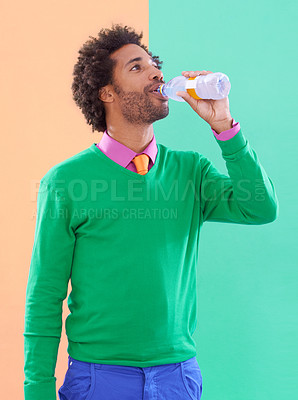 Buy stock photo Drinking water, fashion and man with nutrition, wellness and person on a colourful background. Guy, mockup space and model with liquid and stylish outfit with elegant clothes and healthy with diet