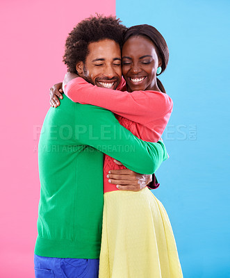 Buy stock photo Hug, love and black couple with marriage, excited and romance on colourful studio background. Relationship, embrace and man with woman or expression with emotion or bonding together with date or care