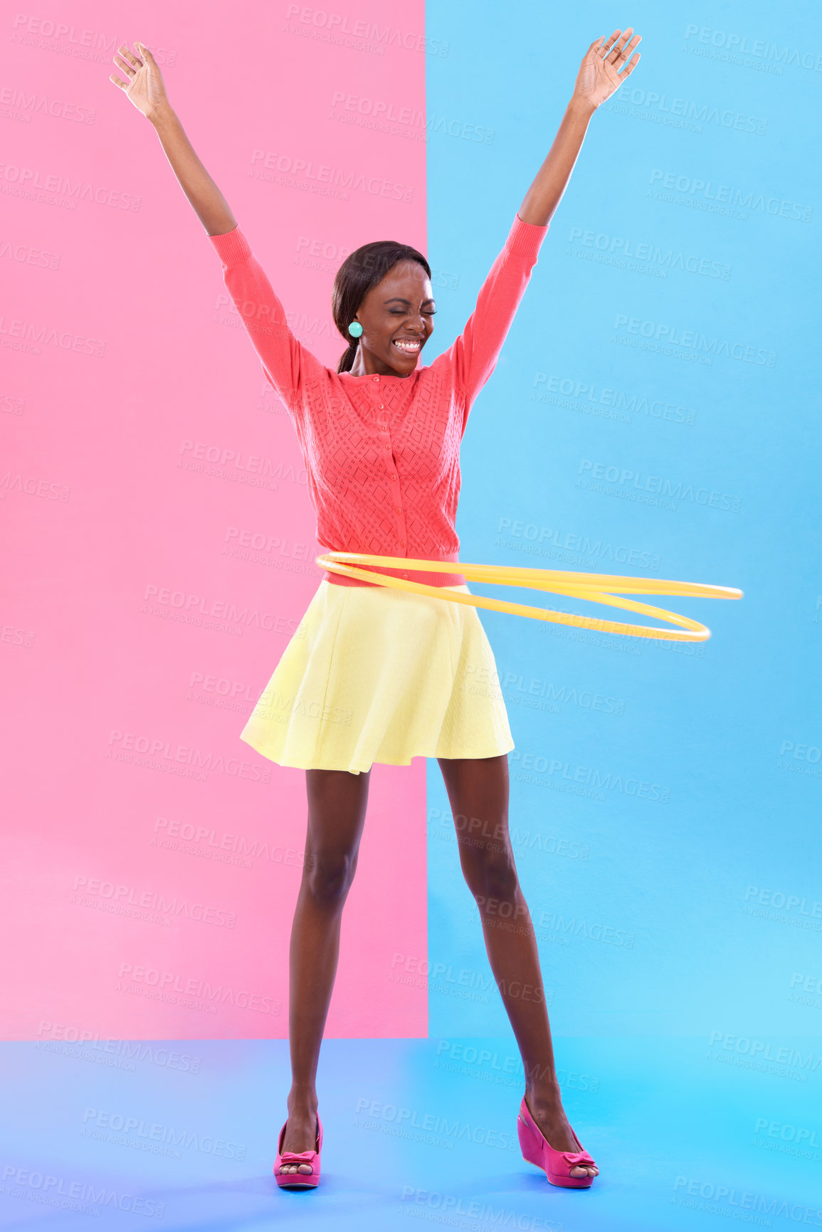 Buy stock photo Woman, smile and hand up for victory, dance and hoop for success on color block background. Winner, female person and spinning of plastic toy to celebrate, achievement or good news in studio