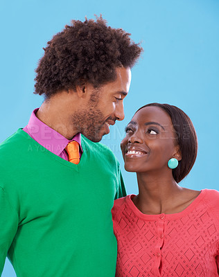 Buy stock photo Hug, love and black couple with marriage, romance and bonding together on a blue studio background. Relationship, embrace and man with woman and peace with support and happiness with a date and care