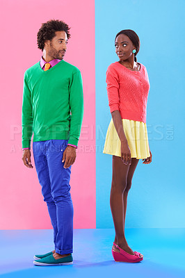 Buy stock photo Fashion, love and young black couple in studio with colorful, trendy and stylish outfit for confidence. Bonding, full body and African man and woman with edgy, classy and retro style by background.