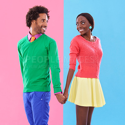 Buy stock photo Fashion, smile and black couple holding hands in studio with colorful, trendy and stylish outfit. Happy, love and young African man and woman with edgy, classy and retro style by background.