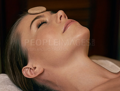 Buy stock photo Massage, relax and woman for facial at spa with treatment for self care to rest, peace and wellness. Closeup, female person and beauty therapy for glow with smooth and natural stone for skin.