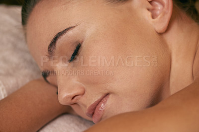 Buy stock photo Woman, lying and relax in spa for peace or wellness, sleeping or daydreaming and calm to free tension. Female person, closeup and luxury for stress relief or rest for wellbeing with aromatherapy.