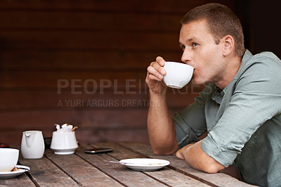Buy stock photo Thinking, idea and man at a cafe for coffee break, chilling or morning caffeine routine. Restaurant, tea cup and male person with moment of reflection, memory or calm contemplation while drinking 