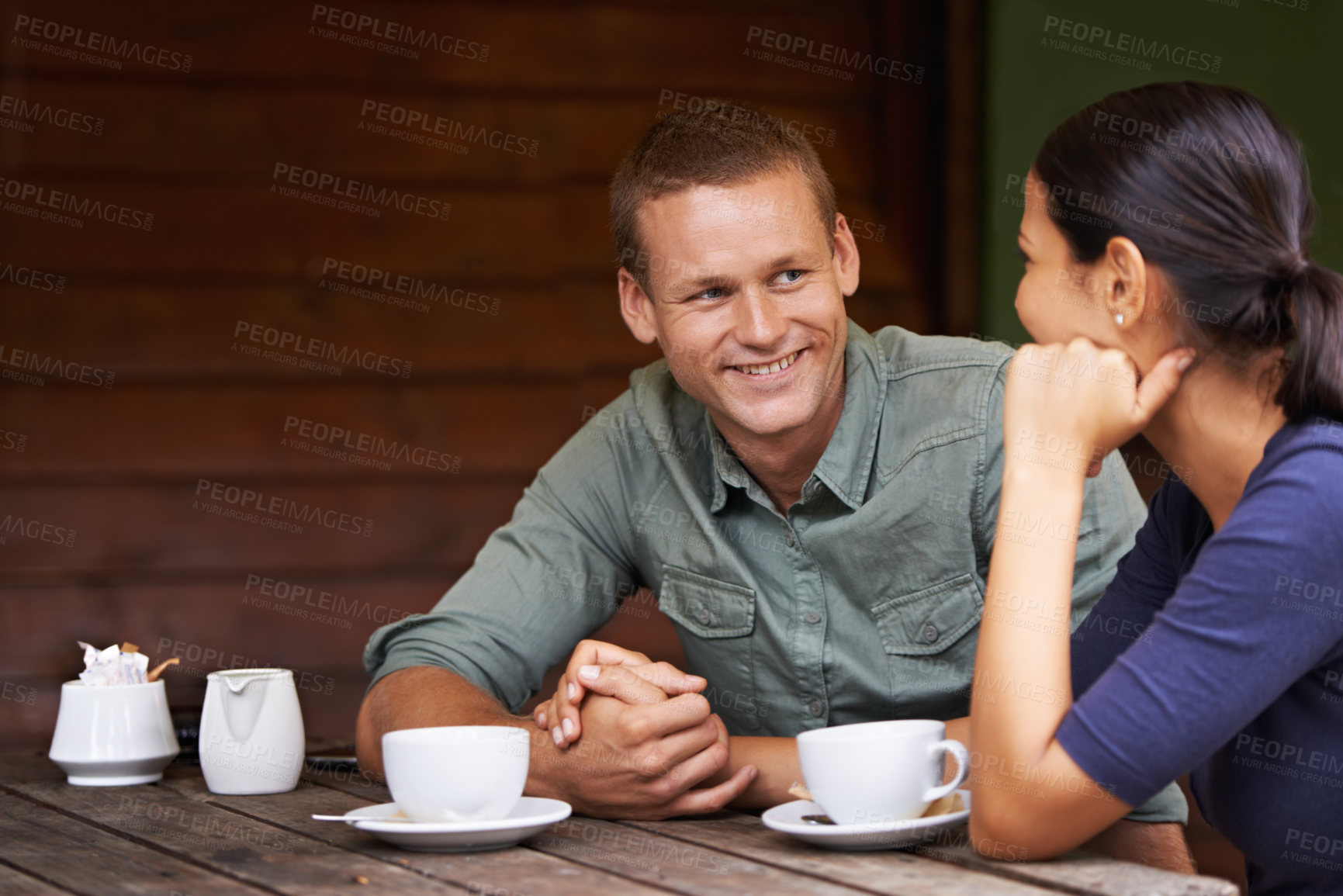Buy stock photo Holding hands, coffee shop and couple with conversation, love and customers with relationship and date. Restaurant, marriage and man with woman and morning with weekend break and bonding together