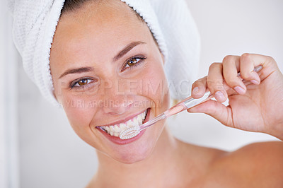 Buy stock photo Portrait of a beautiful woman brushing her teeth