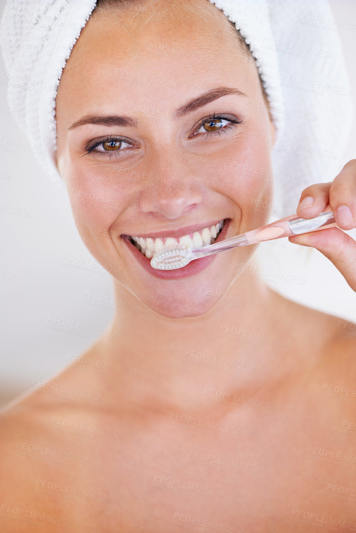 Buy stock photo Portrait of a stunning woman brushing her teeth