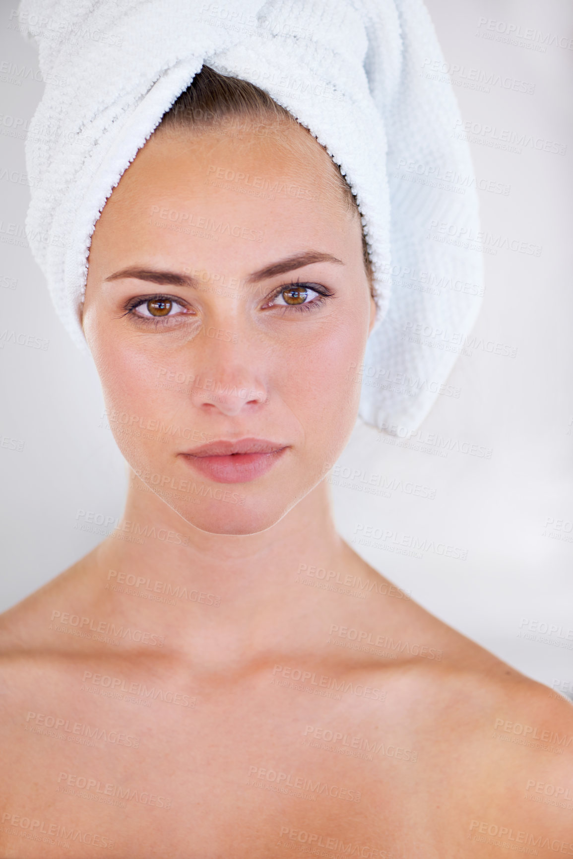 Buy stock photo Close up of an attractive woman wearing a towel on her head