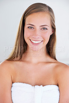 Buy stock photo Front view shot of a beautiful woman wrapped in a towel