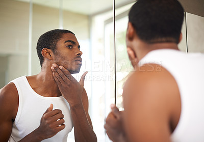 Buy stock photo Bathroom, mirror and black man grooming for skincare, self care and treatment for face of adult. African male person, morning and health with dermatology for results of soft, shave and glow of skin