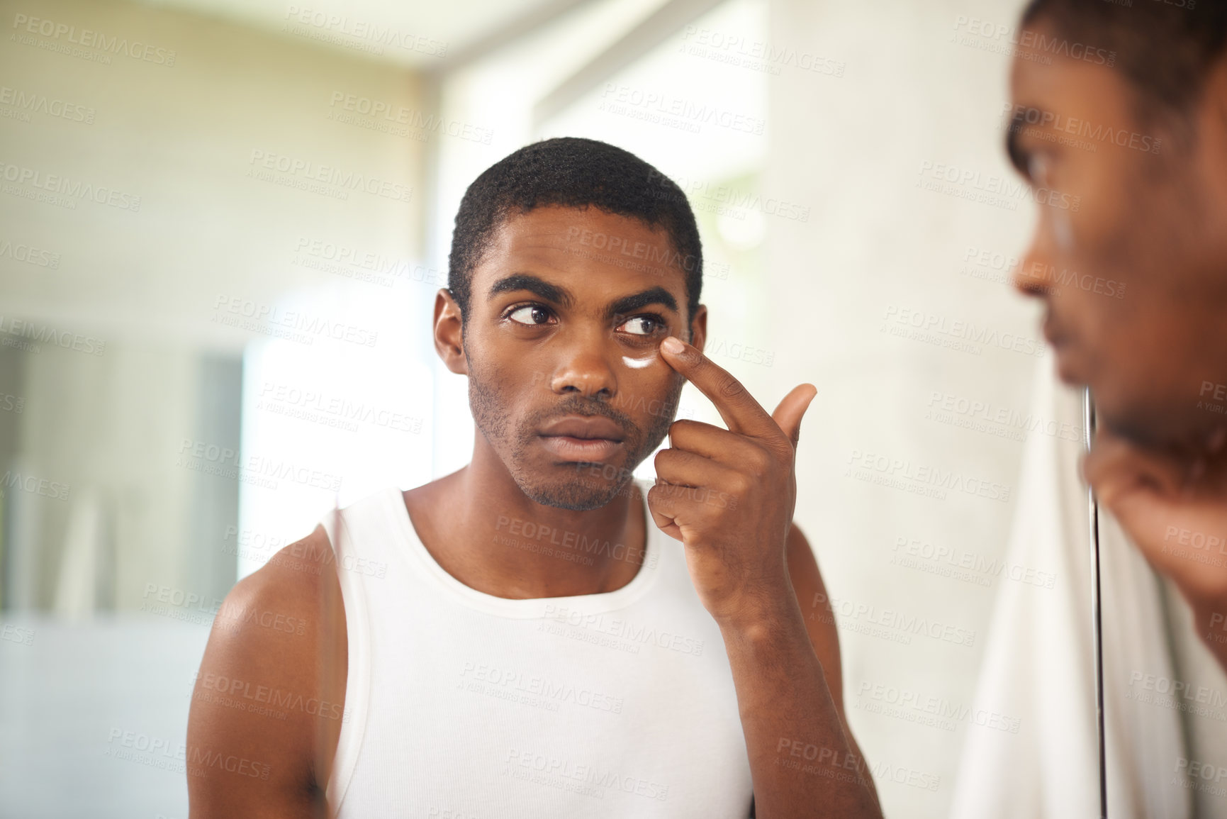 Buy stock photo Bathroom, cream and black man grooming for skincare, self care and treatment for melasma on face. African male person, morning and health with dermatology for results of soft, shine and glow of skin