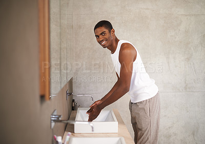 Buy stock photo Bathroom, sink and black man washing of hands, portrait and smile for cleaning with water from tap. Health, hygiene and male person happy with protection from bacteria, germs and viruses with liquid 