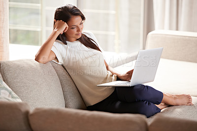 Buy stock photo Laptop, internet and a woman relax at home while  streaming movies. Calm female person on lounge couch browsing and reading email, research or social media and online shopping with tech connection 