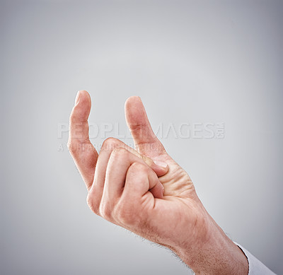 Buy stock photo Sign, hand and gap to show for size, results and scale for quantity on mockup with grey background. Gesture, finger and thumb to explain little, number and idea for short, growth or loss in studio