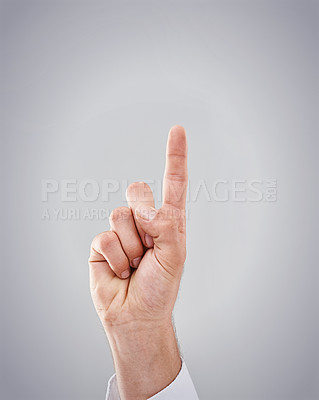 Buy stock photo Sign, index and finger to show for idea, direction and number for growth, position and quantity. Gesture, hand and signal to point first, one and increase in studio on mockup on grey background