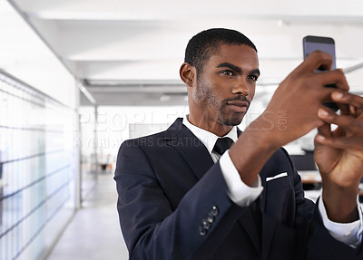Buy stock photo Businessman, serious and selfie in office for memory of job interview, pride and social media post. Man, photography and pose at company with confidence for lawyer, career or startup at work