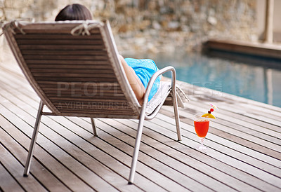 Buy stock photo Deckchair, woman and cocktail at poolside for holiday or getaway on weekend in summer. Rear view and break with alcohol beverage or juice for refresh and relax on vacation, resort or lodge to tan