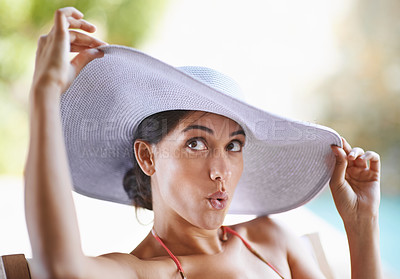 Buy stock photo Woman, bikini and holiday for fashion, hat and vacation at resort in Dubai by swimming pool. Female person, getaway and happy in summer, break and outdoor for wellness and relaxation in travel trip