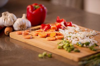 Buy stock photo Chopped veggies, cutting board and meal prep for chef, restaurant and bistro for healthy eating. Food, kitchen and nutrition for lunch, dinner and home cooking cuisine for diet or vegan appetite