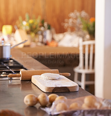 Buy stock photo Dough, pin and wooden board in kitchen with ingredients  on counter for baking and cooking with pastry for bread with recipe. Flour, wheat and potatoes with stove and pot for food with vegetables