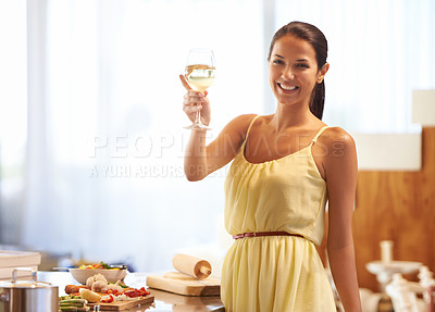 Buy stock photo Woman, happy and smile with wine glass while cooking, vegetables and cheers for celebration in kitchen. Female person, food and alcohol while preparing dinner, meal for nutrition at home or house
