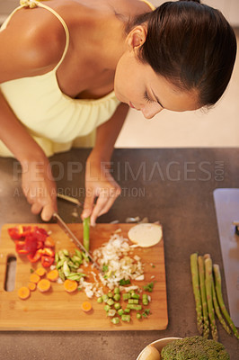 Buy stock photo Cooking, food and health with chef in kitchen of home to prepare meal for diet or nutrition from above. Woman, nutritionist or vegan and person cutting green vegetables with knife in apartment