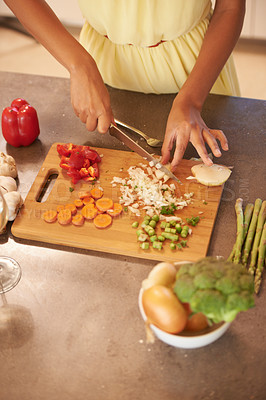 Buy stock photo Hands, cooking and food with person in kitchen of home from above for health, diet and nutrition. Table, ingredients or recipe and chef chopping or cutting vegetables with knife closeup in apartment